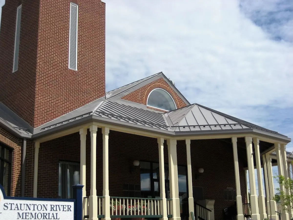 Skilled roofing craftsmen working on a residential roof in McMicken